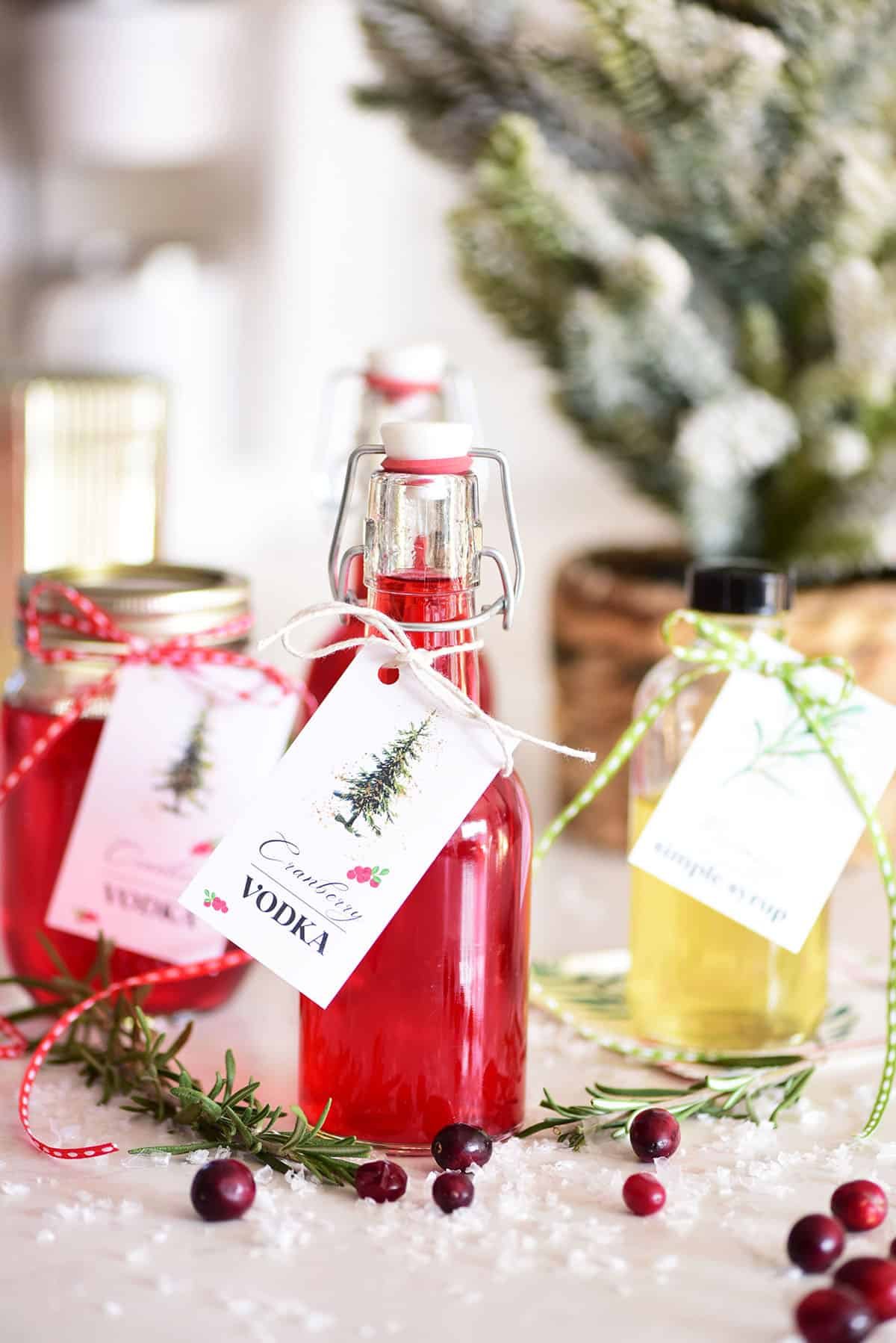bottles filled with cranberry vodka