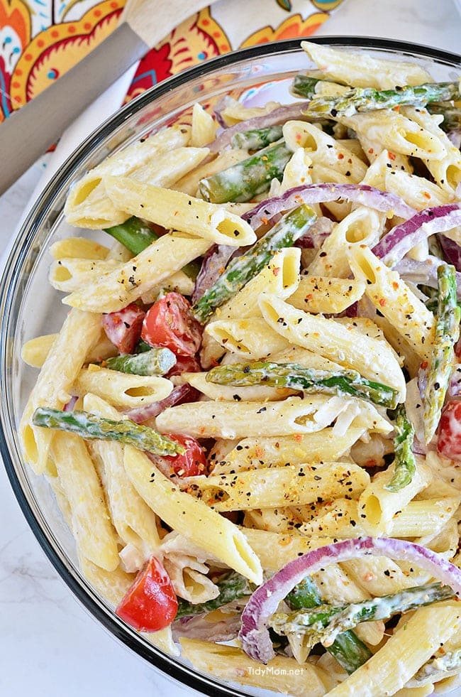 Creamy Asparagus Pasta Salad comes with an extra punch of flavor from fresh lemon juice and makes a perfect spring side dish. Add grilled chicken and it could be a meal all on it’s own. Recipe at cetcu.com