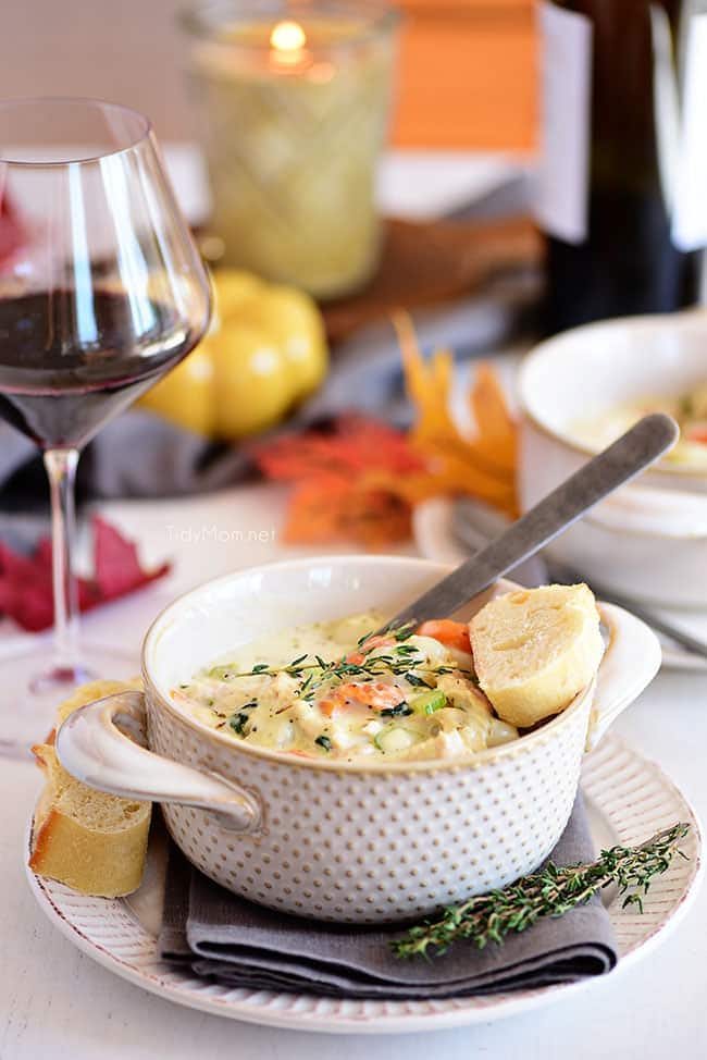 A bowl of creamy chicken gnocchi soup on a dinner table