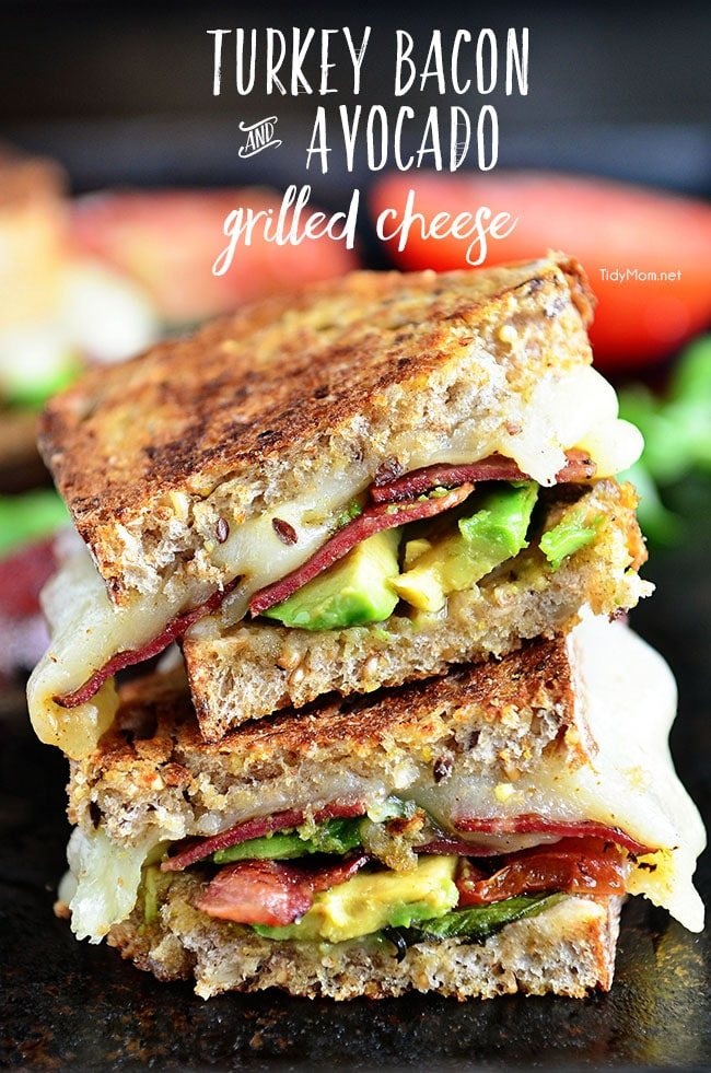 Turkey Bacon and Avocado Grilled Cheese sandwich loaded with fresh basil, tomatoes and mozzarella cheese on a hearty artisan bread. Recipe at cetcu.com