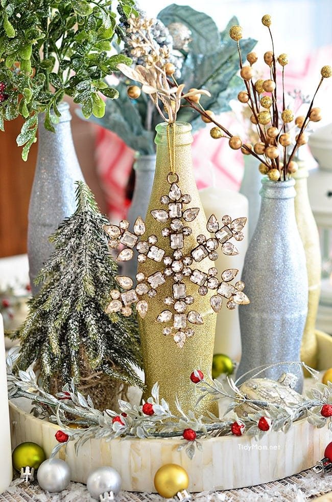 Use empty Cocoa Cola bottles as a pretty holiday table centerpiece. Just paint with glitter spray paint and add some holiday florals, and arrange on a tray. Easy and costs almost nothing! details at cetcu.com