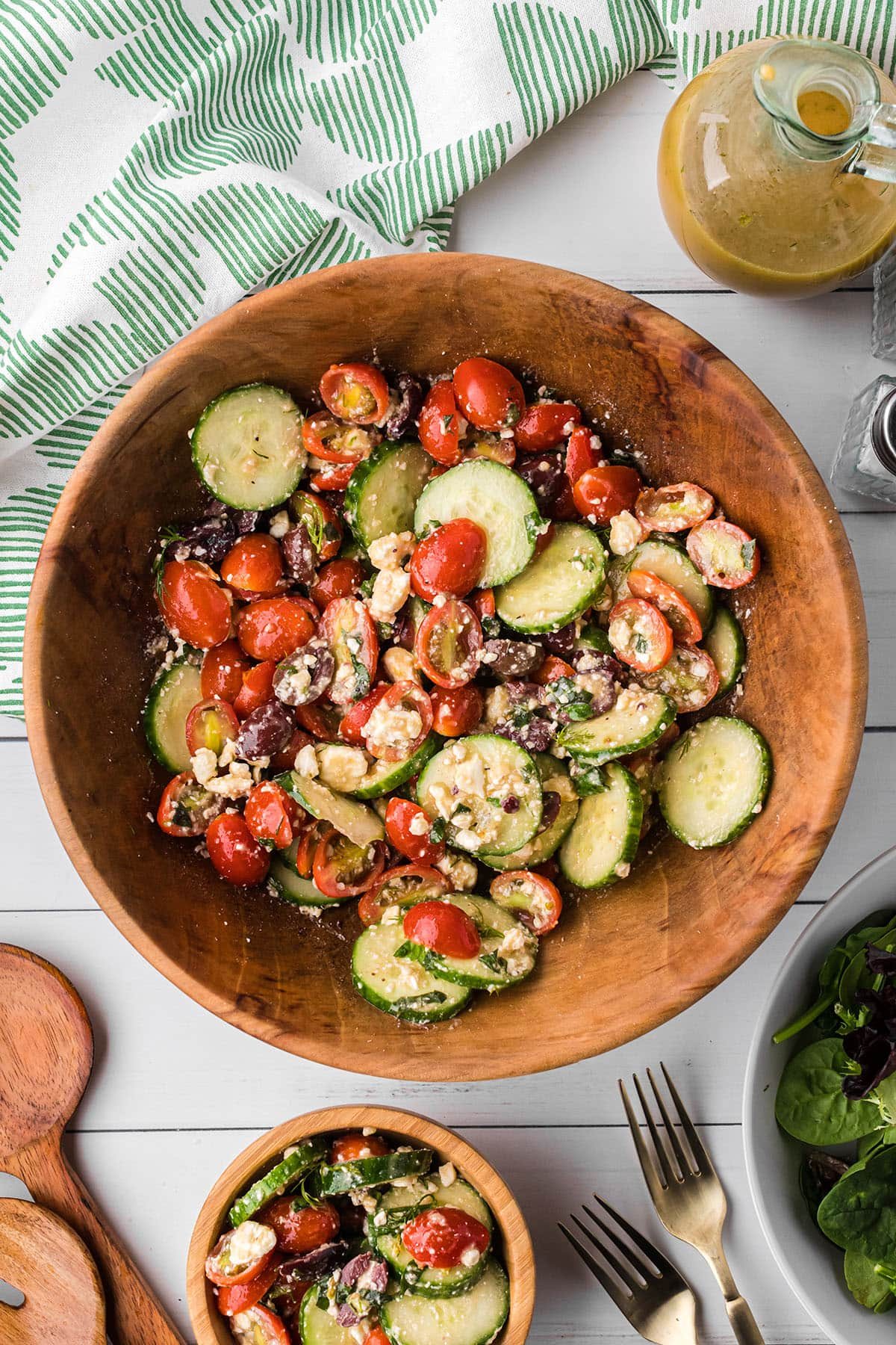 cucumber and tomato salad in a wooden bowl