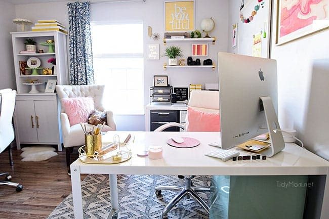 Decorating a shared office, with colorful industrial style. Her side is pink and gold, while his is black and neutrals. Check out the gold coffee cart!! Get all the details of this shared home office space at cetcu.com