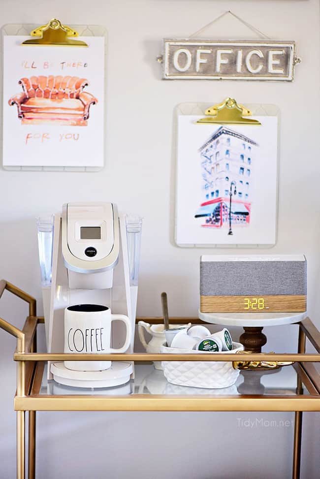Decorating a shared office, with colorful industrial style. Her side is pink and gold, while his is black and neutrals. Check out the gold coffee cart!! Get all the details of this shared home office space at cetcu.com