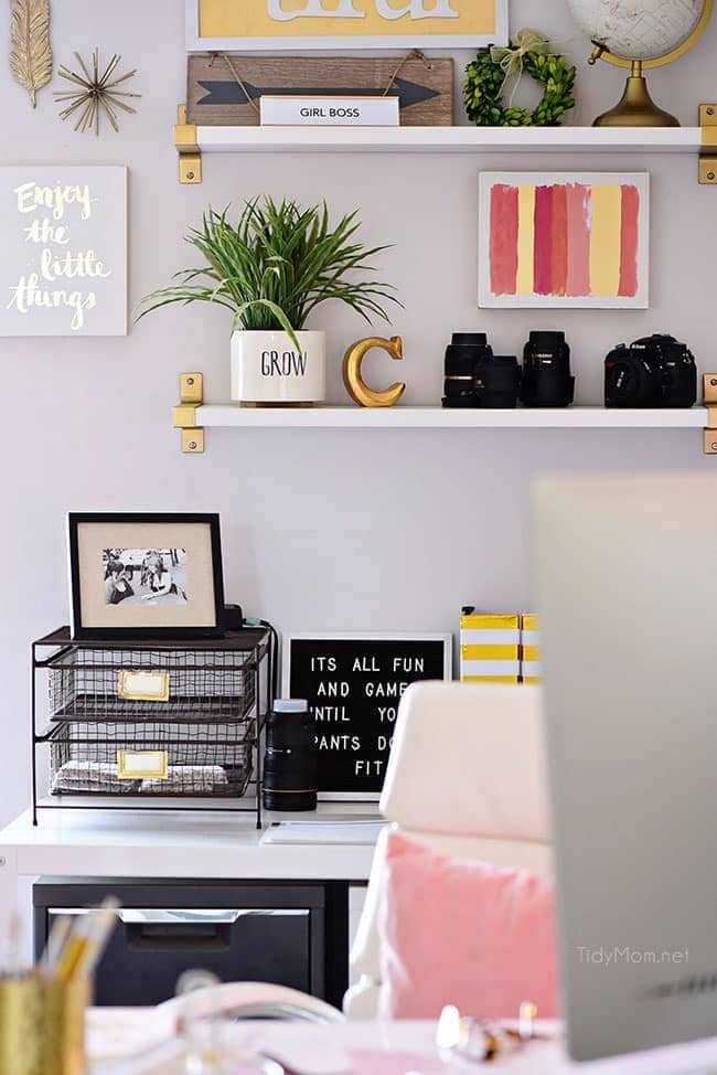 Decorating a shared office, with colorful industrial style. Her side is pink and gold, while his is black and neutrals. Check out the gold coffee cart!! Get all the details of this shared home office space at cetcu.com