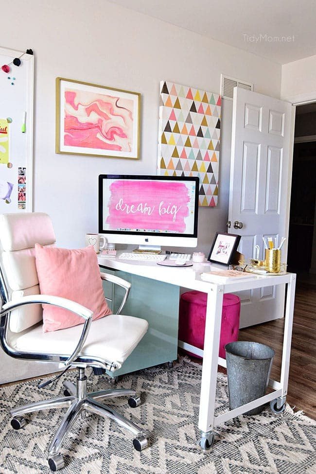 Decorating a shared office, with colorful industrial style. Her side is pink and gold, while his is black and neutrals. Check out the gold coffee cart!! Get all the details of this shared home office space at cetcu.com