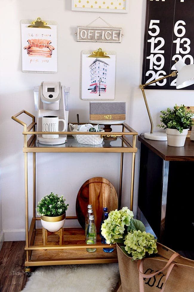 Decorating a shared office, with colorful industrial style. Her side is pink and gold, while his is black and neutrals. Check out the gold coffee cart!! Get all the details of this shared home office space at cetcu.com