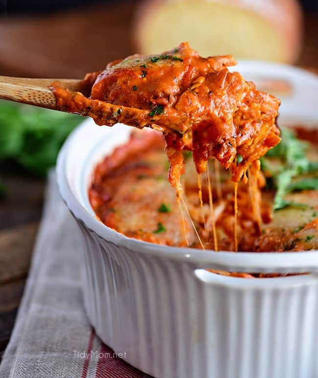 Cheesy Ravioli Bake with Chicken is easy to make and impossible to resist. Making it the perfect weeknight dish. Cheese ravioli, marinara sauce, chicken and lots of cheese, all layered and baked until bubbly and gooey! Print casserole recipe + view short recipe video at cetcu.com