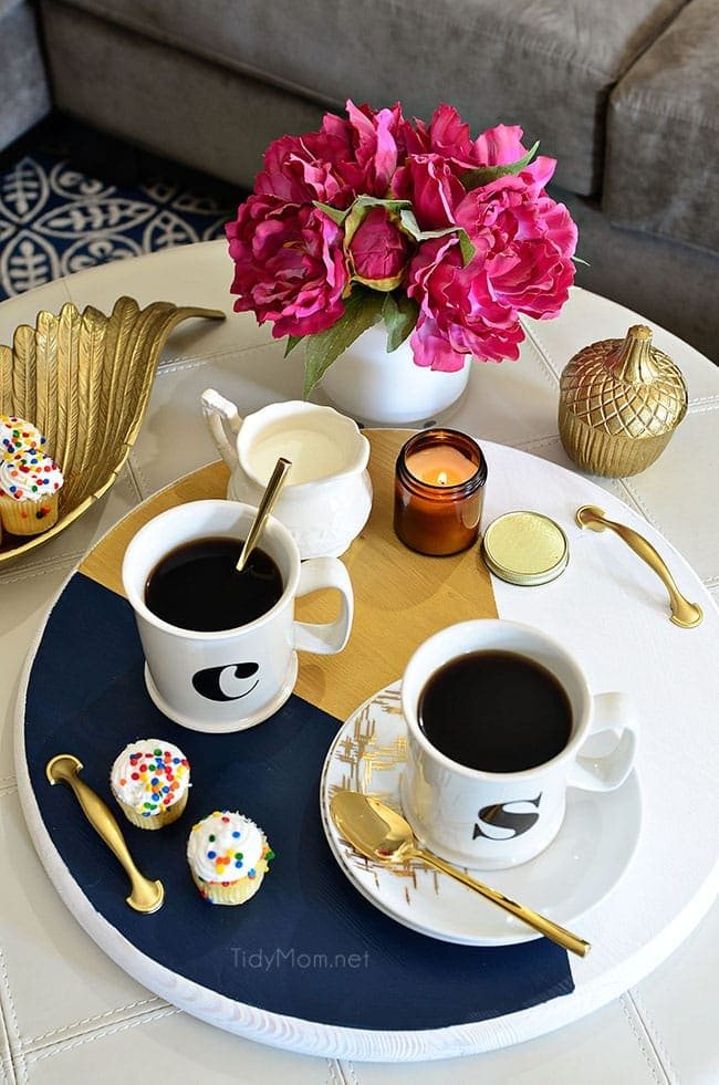A bold colorful tray is the perfect way to add a pop of color to a space and use it as a serving tray when entertaining. The color blocking gives this tray a modern look while the touch of gold adds a little elegance! Get the full tutorial to make your own DIY Color Block Tray at cetcu.com