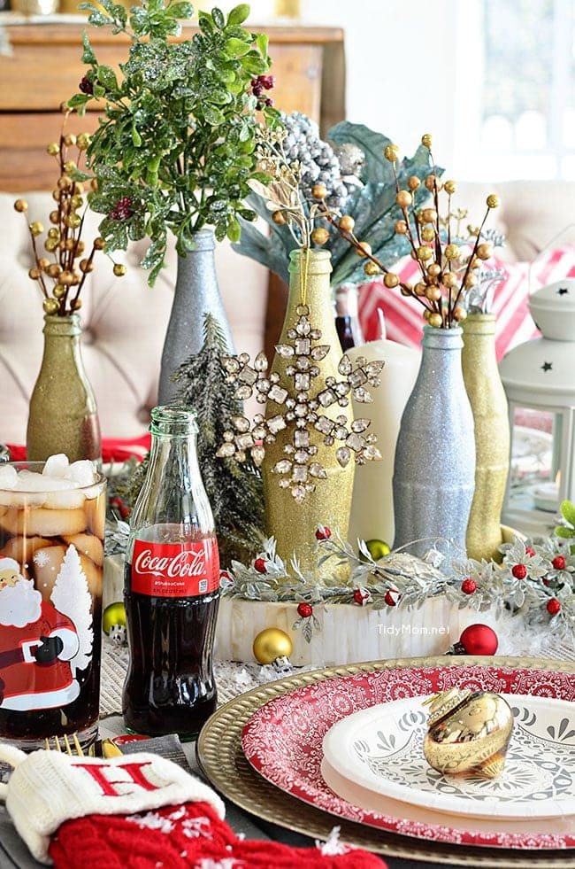 Use empty Cocoa Cola bottles as a pretty holiday table centerpiece. Just paint with glitter spray paint and add some holiday florals, and arrange on a tray. Easy and costs almost nothing! details at cetcu.com