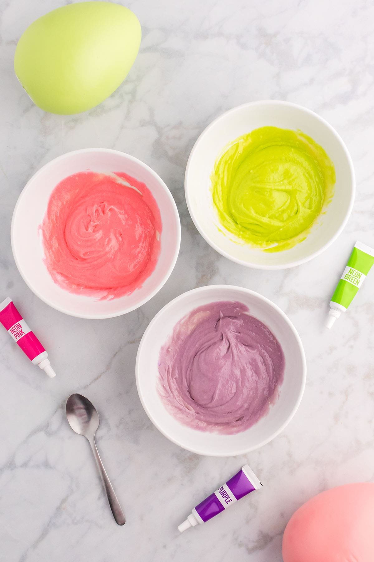 3 bowls of tinted cake batter