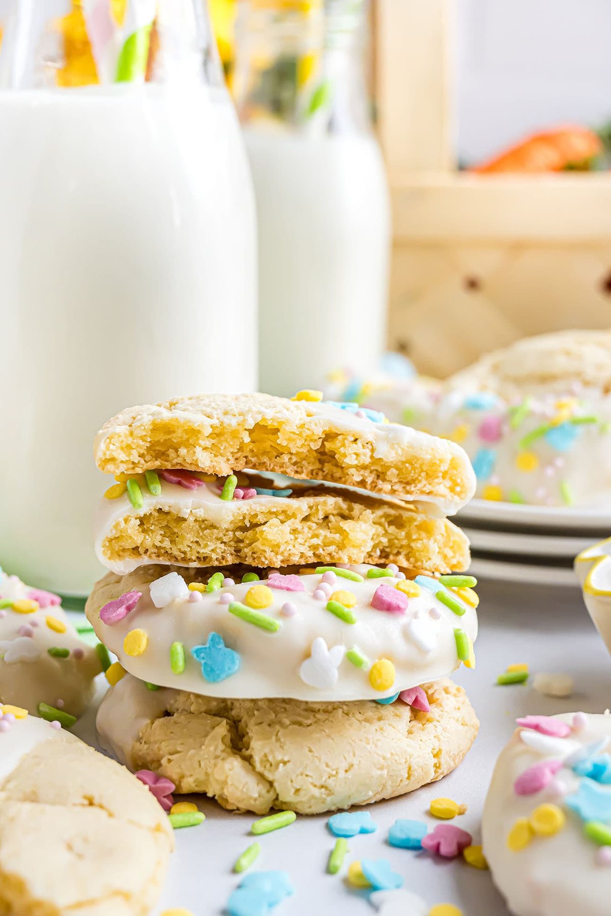 stack of easter cookies and bottles of milk