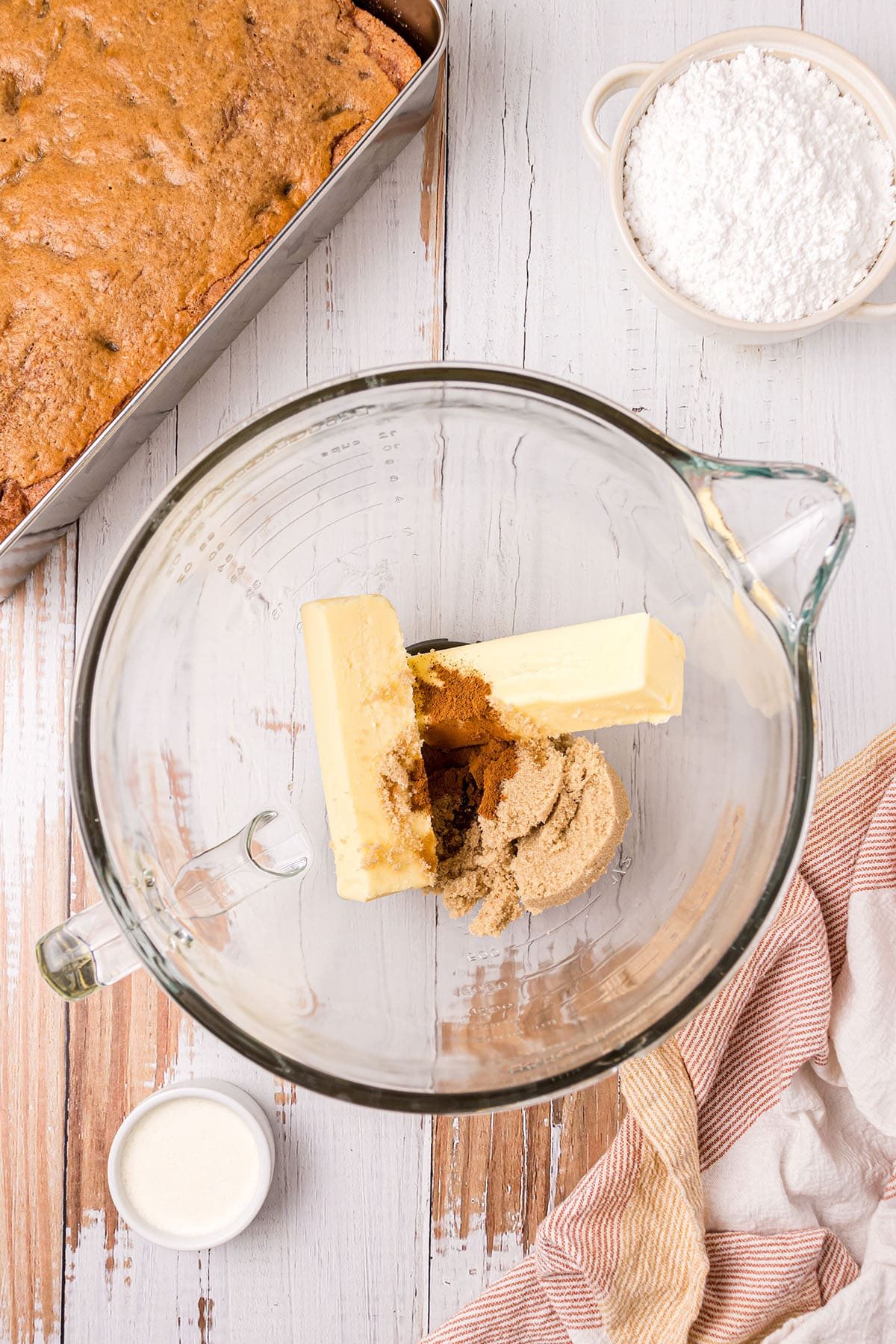 butter and sugar in glass mixing bowl