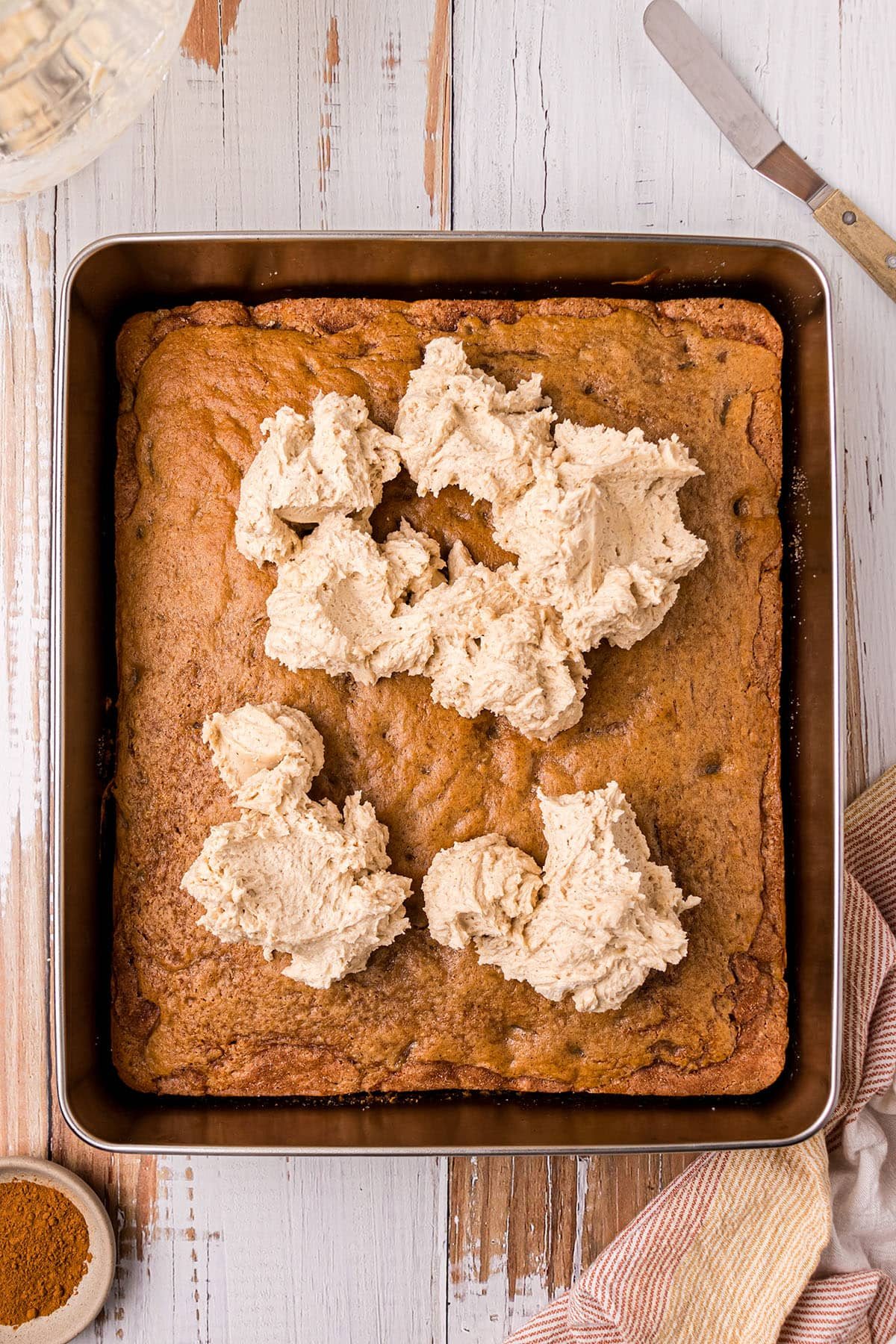 dollops of frosting on a cake