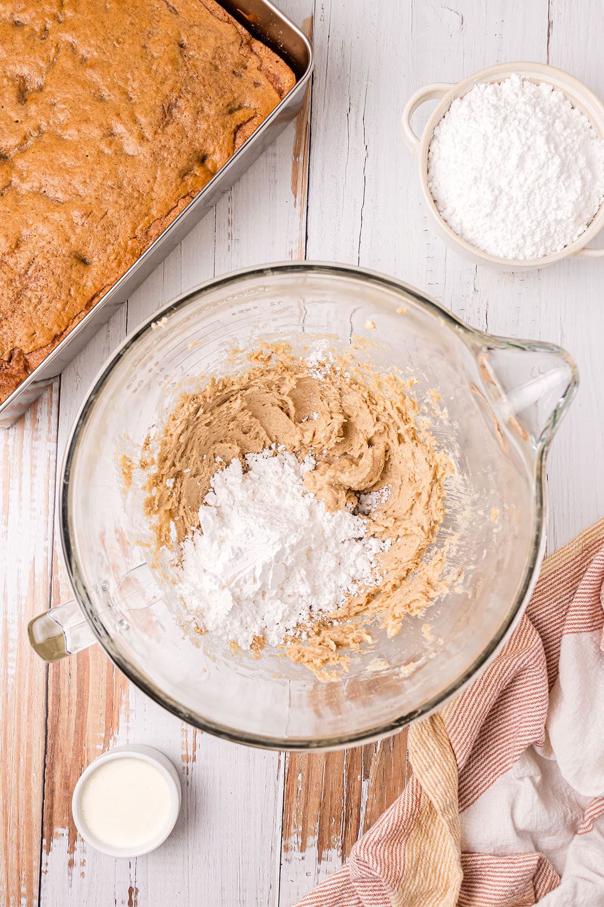 making frosting in a glass mixing bowl