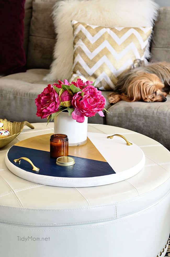 A bold colorful tray is the perfect way to add a pop of color to a space and use it as a serving tray when entertaining. The color blocking gives this tray a modern look while the touch of gold adds a little elegance! Get the full tutorial to make your own DIY Color Block Tray at cetcu.com