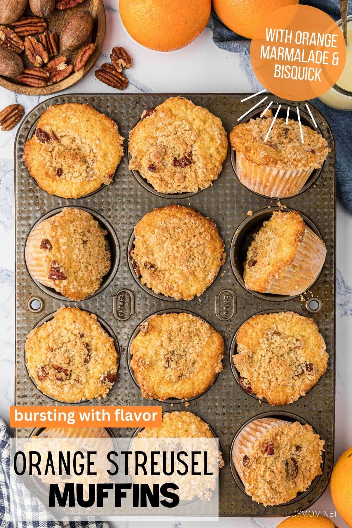 muffin pan with baked orange muffins