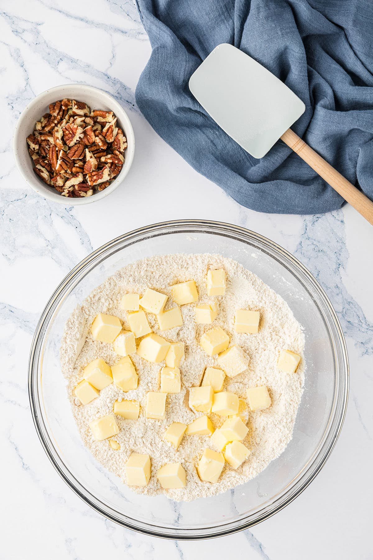 chopped cold butter in a glass mixing bowl for streusel topping