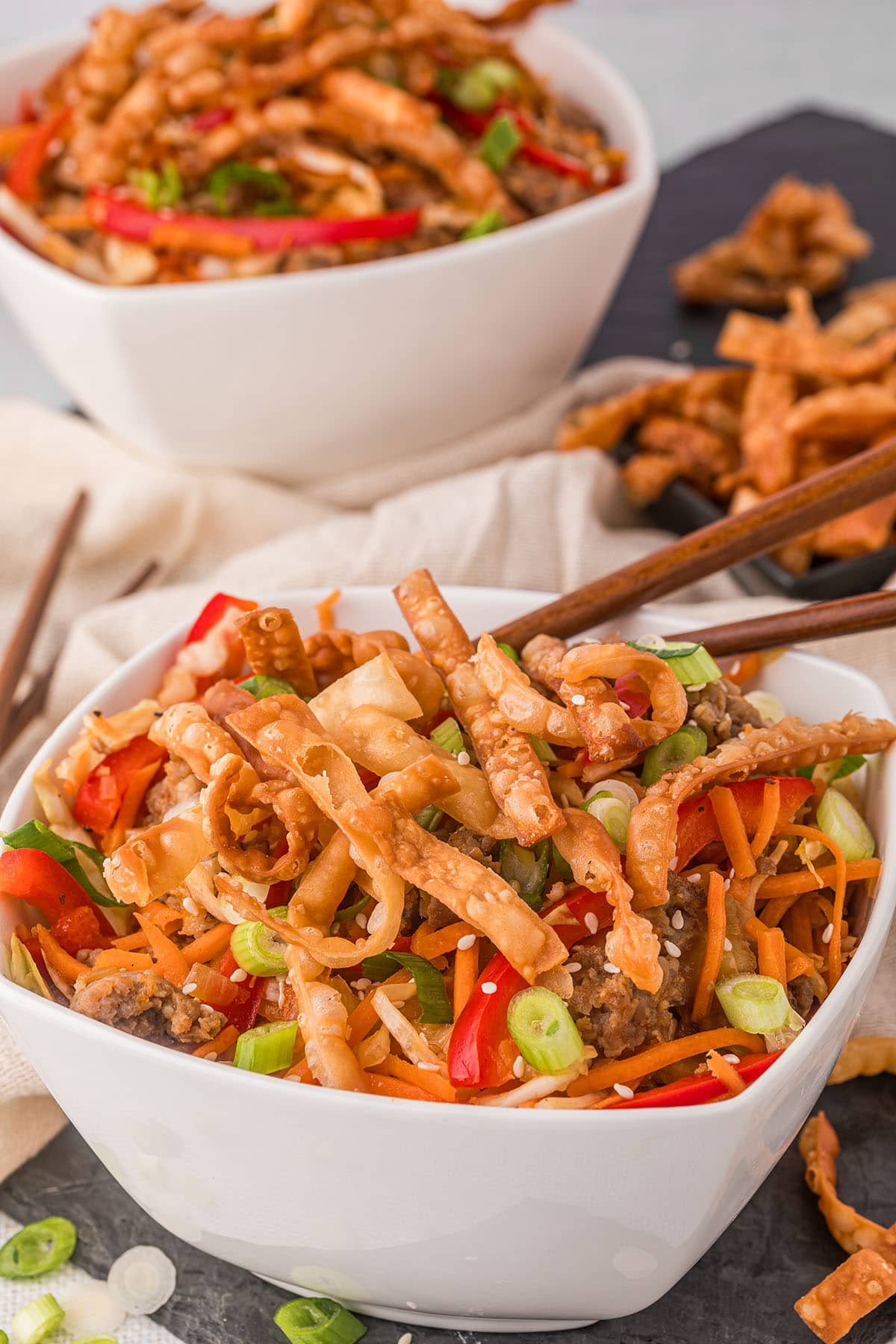 Egg Roll in a Bowl served in white bowls with chopsticks