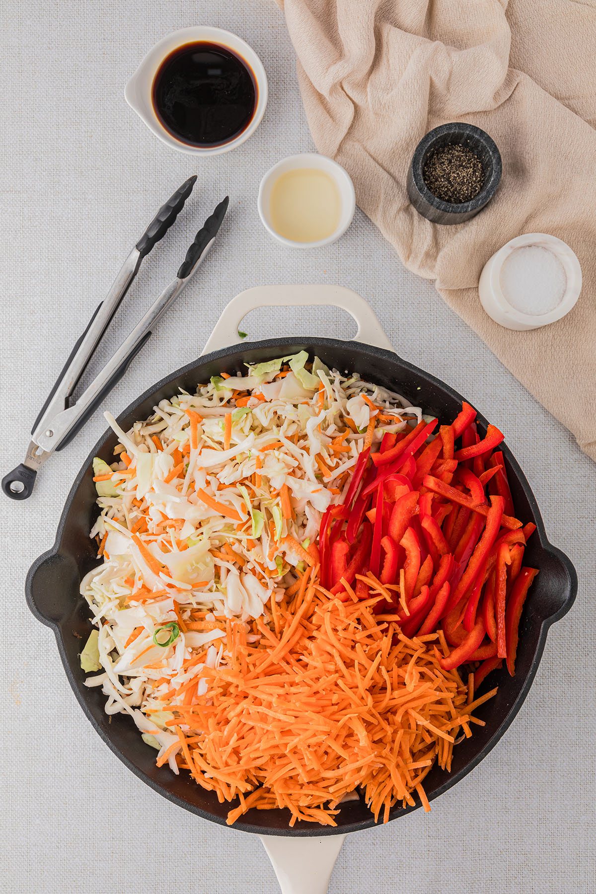 veggies cooking in a cast iron skillet