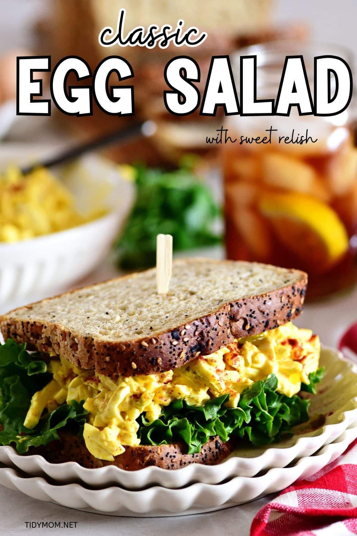 egg salad sandwich with lettuce on wheat bread