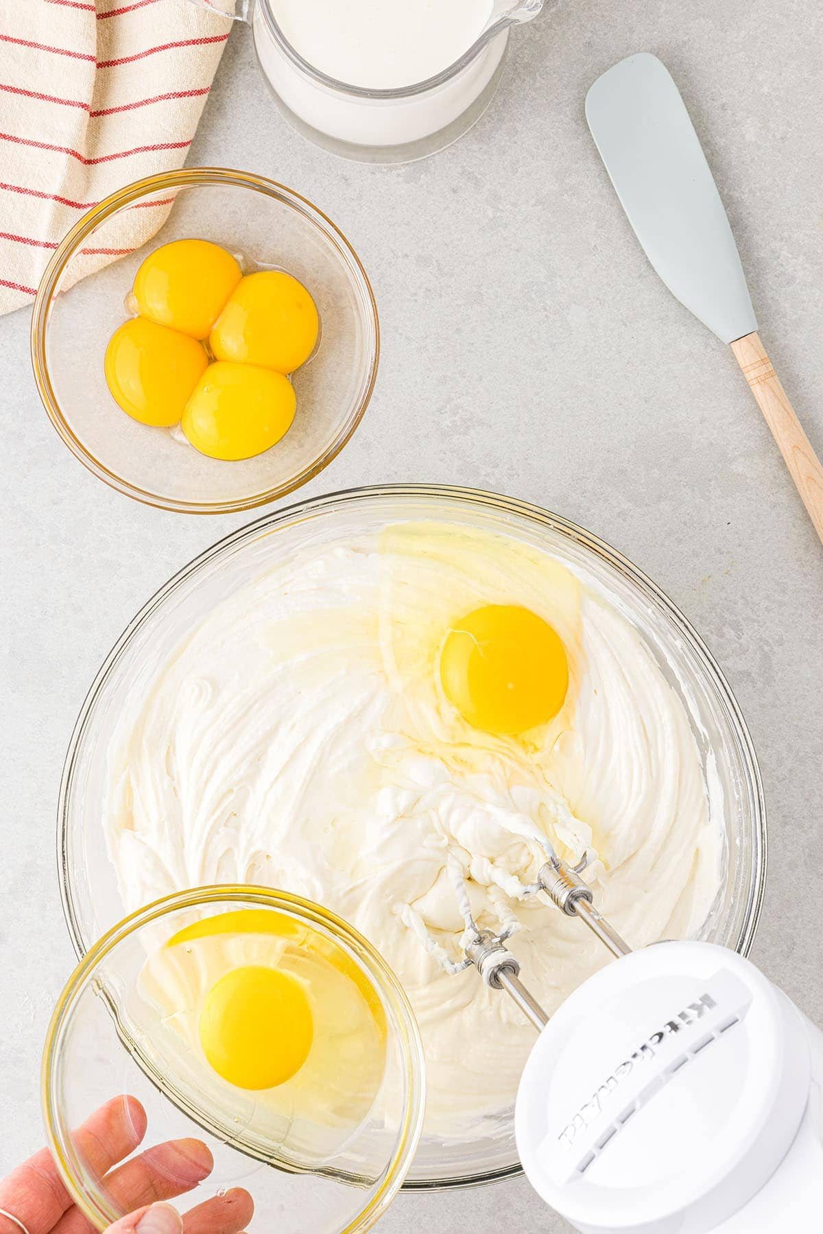 mixing up eggnog cheesecake filling