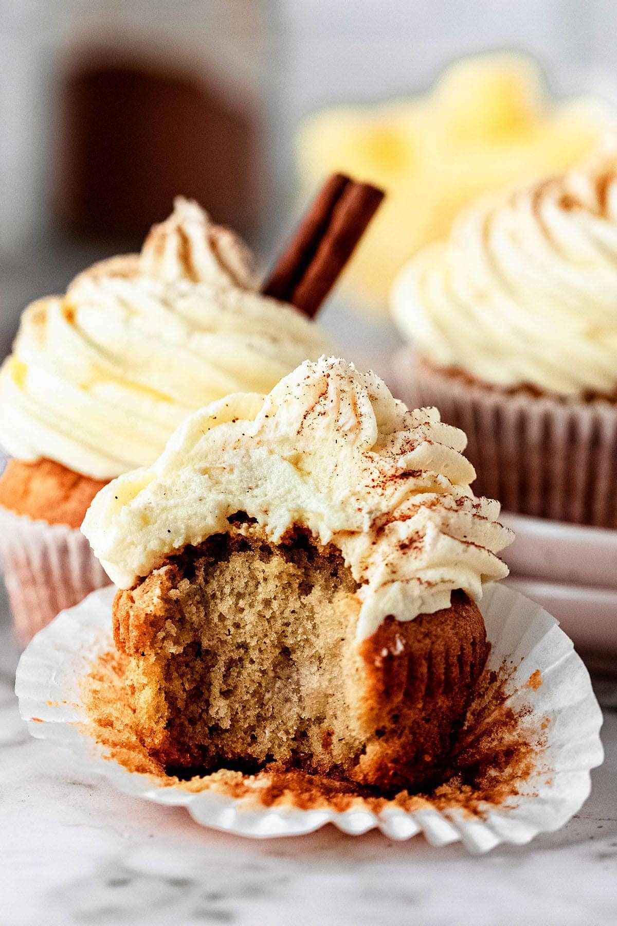 eggnog cupcake with bite taken out.
