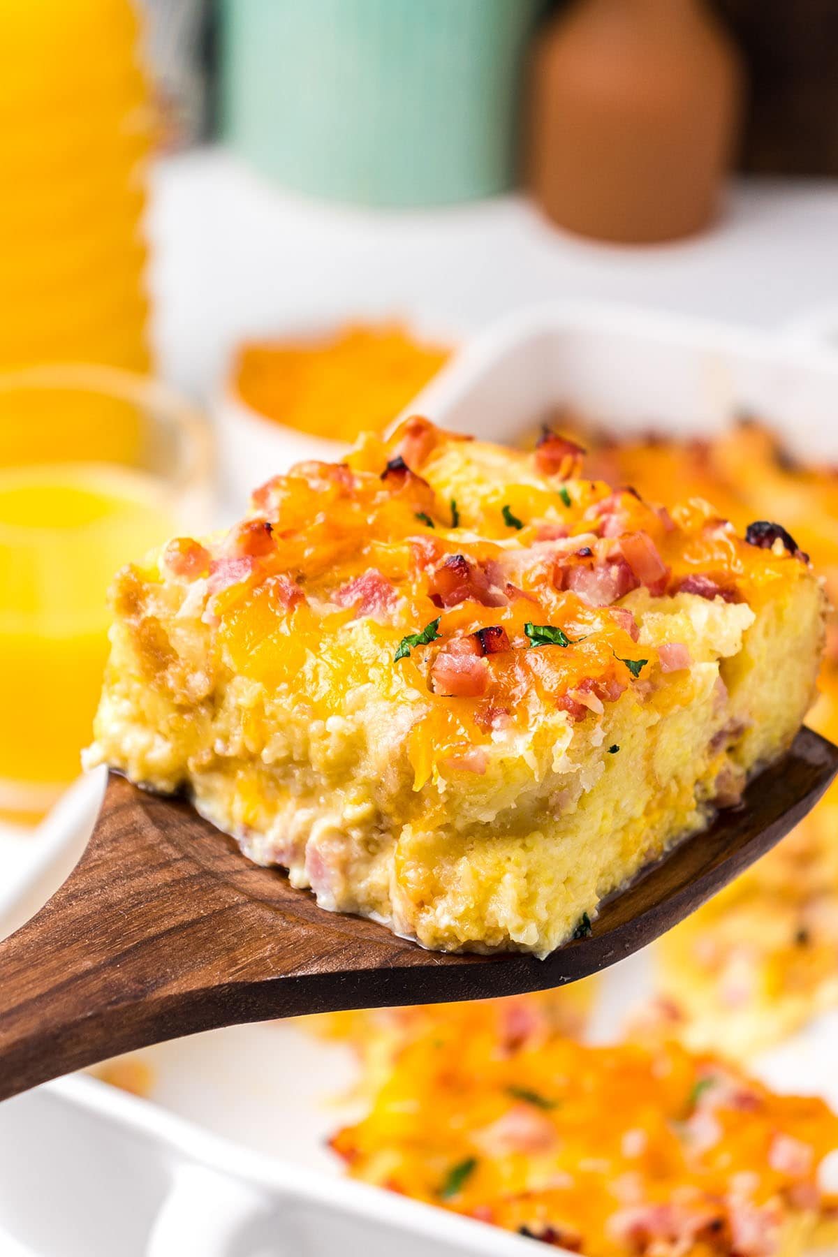 serving of egg casserole on a wooden spatula