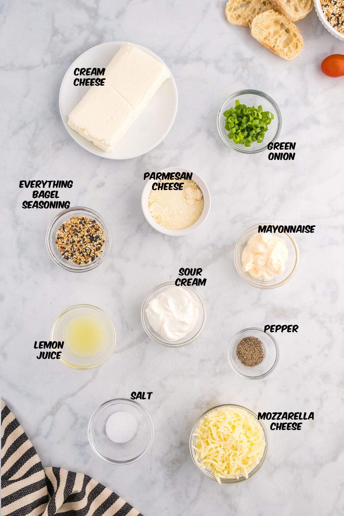 everything bagel dip ingredients on a counter