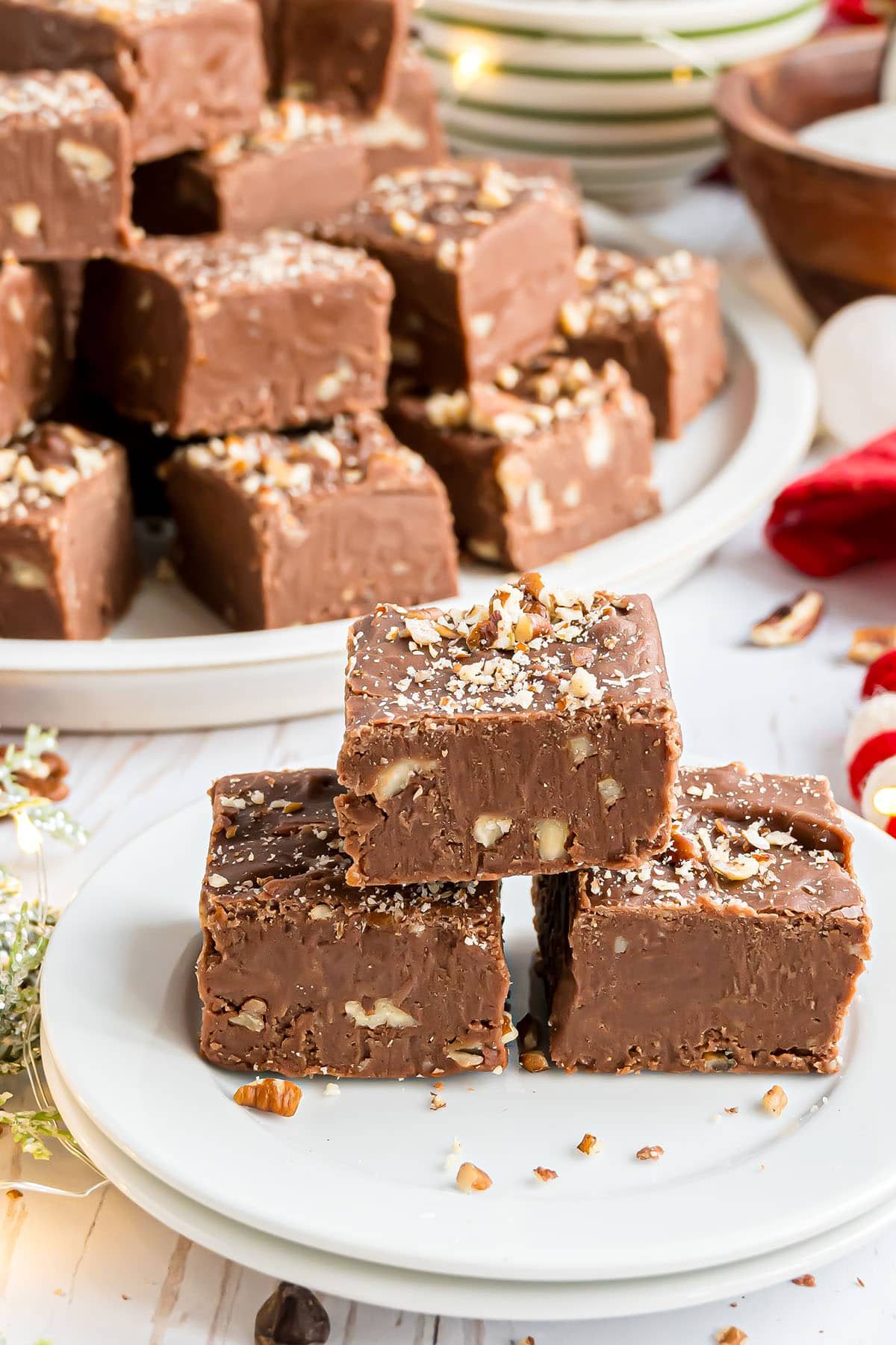 squares of microwave fantasy fudge on a white plate
