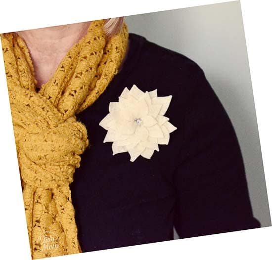 poinsettia pin on shirt