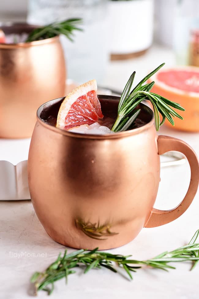 This Grapefruit Moscow Mule is just the right balance of spicy freshness that is the ginger beer and fresh grapefruit combo. Making this cocktail wonderfully refreshing. Perfect for sipping on the deck with friends, at a bridal shower or holiday gathering.Print the full recipe at cetcu.com #cocktails #cocktailrecipes #moscowmule #summercocktails #springcocktails #grapefruit #vodka #vodkacocktails #mothersday #easter #summerentertaining