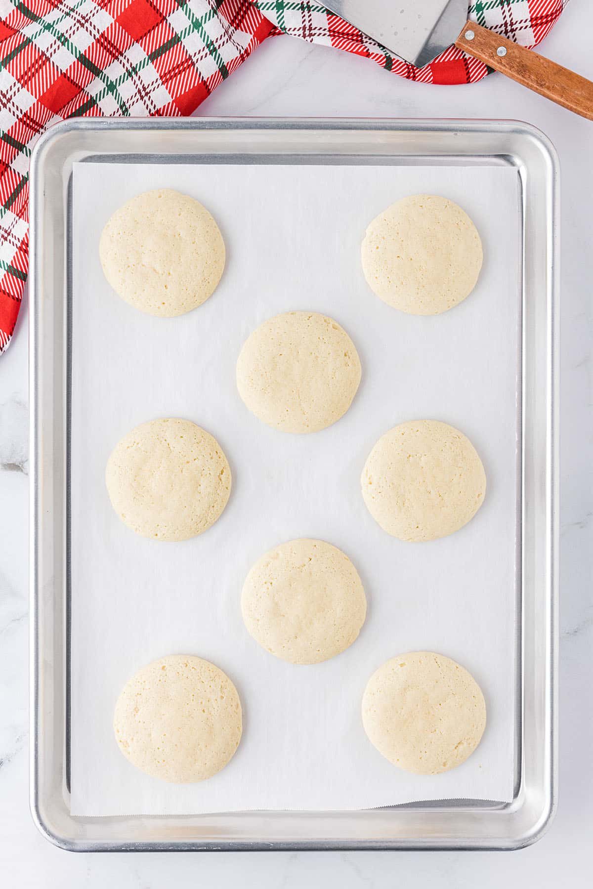 fresh baked sugar cookies ready to be frosted