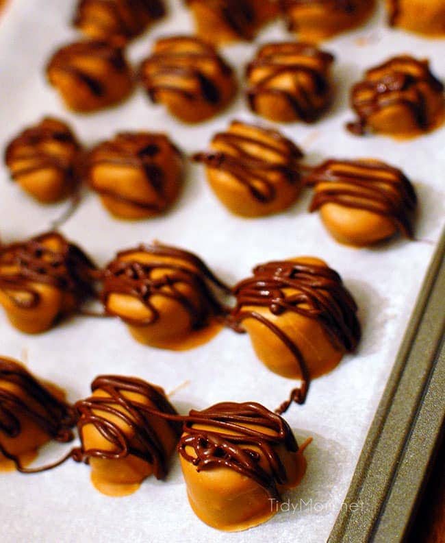 frozen peanut butter banana bites on baking sheet pan