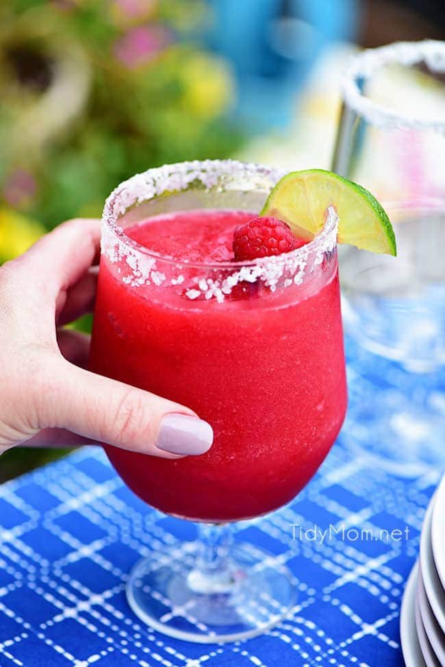 Frozen Raspberry Margarita is the perfect summer cocktail. Raspberry sorbet puts a refreshing twist on the traditional margarita, for a cool party sip! Get the full recipe at cetcu.com - always a hit