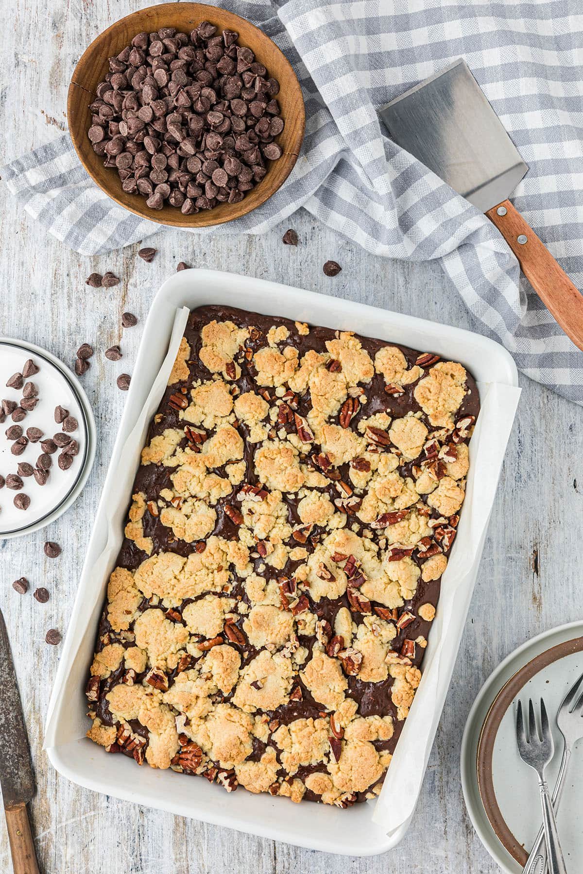 baked fudge nut cookie bars in a white baking dish