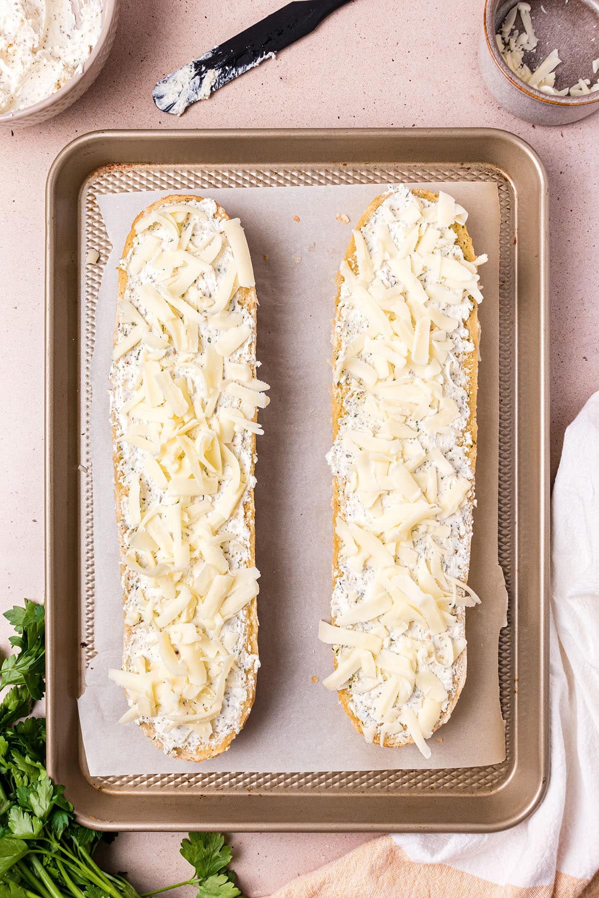 cheese topped french bread ready for the oven