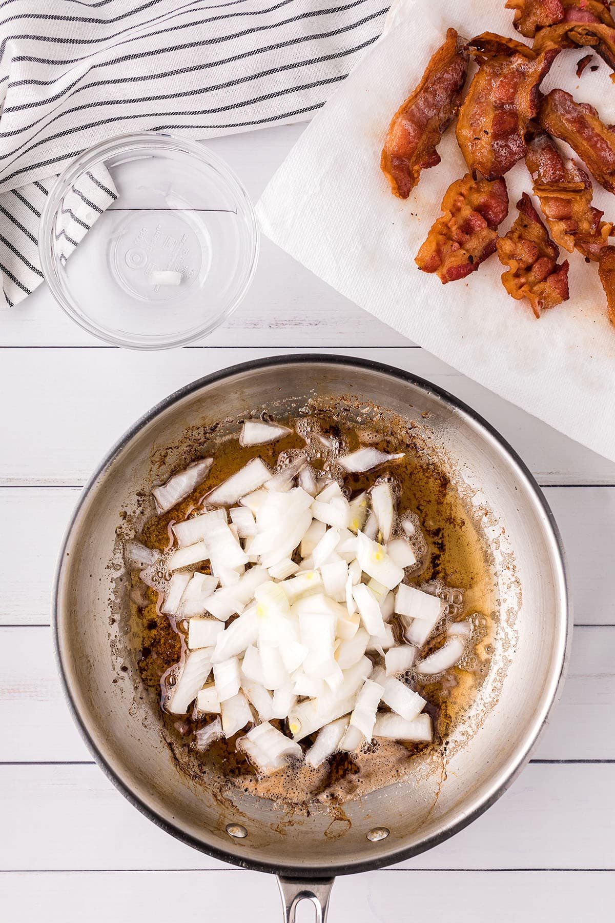 cooking onions in a skillet with bacon grease