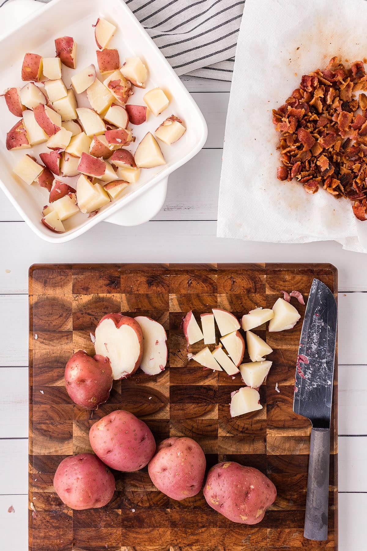 chopping potatoes on a cutting board