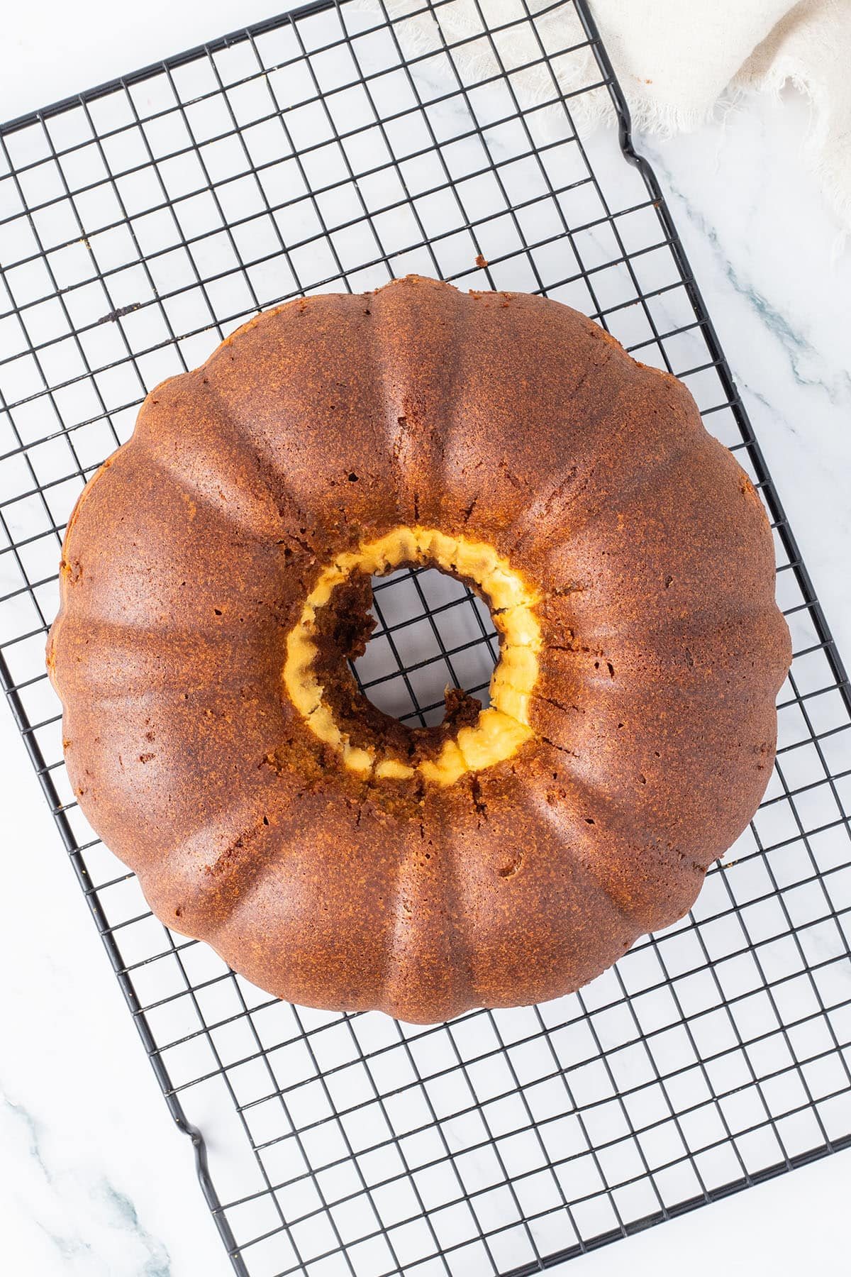 baked bundt cake on a cooling rack