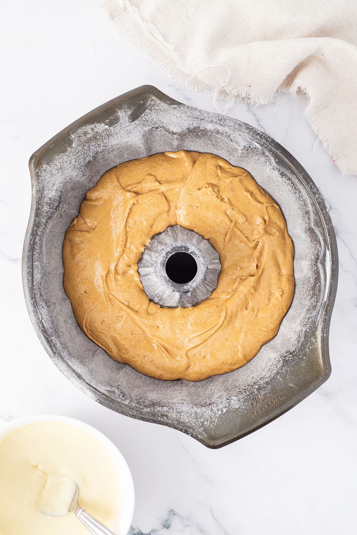 gingerbread cake batter in a bundt pan