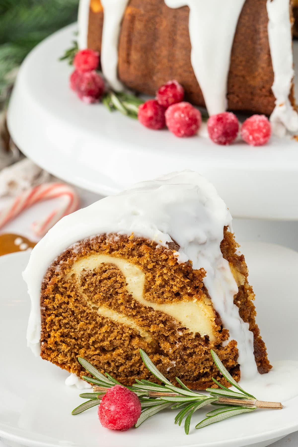 Gingerbread Bundt Cake with sugared cranberries and fresh rosemary sprigs
