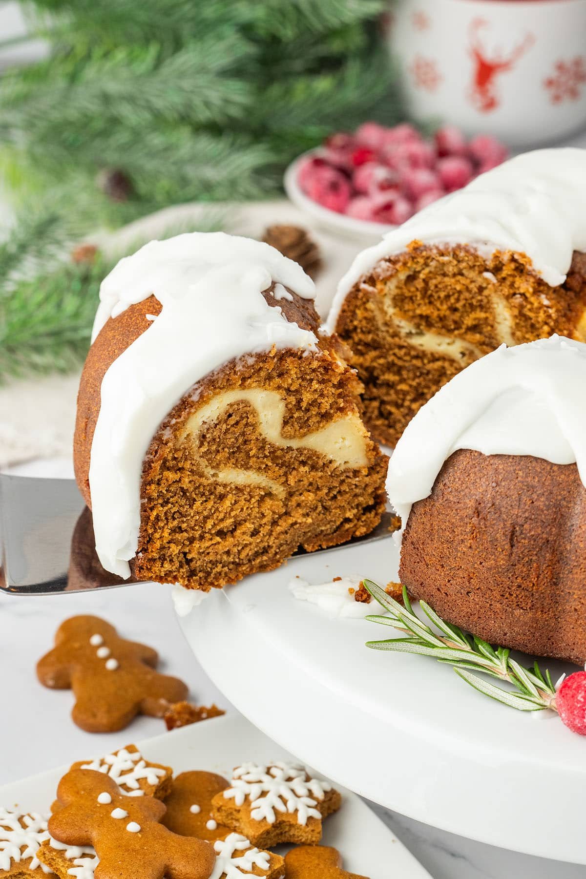 cutting a piece of Gingerbread Bundt Cake