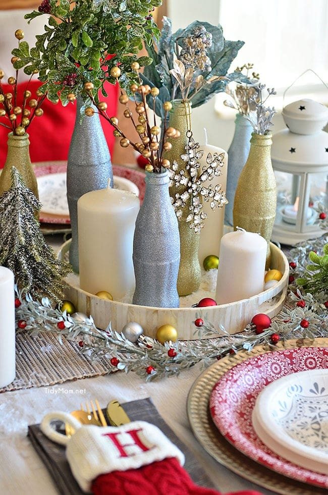 Use empty Cocoa Cola bottles as a pretty holiday table centerpiece. Just paint with glitter spray paint and add some holiday florals, and arrange on a tray. Easy and costs almost nothing! details at cetcu.com