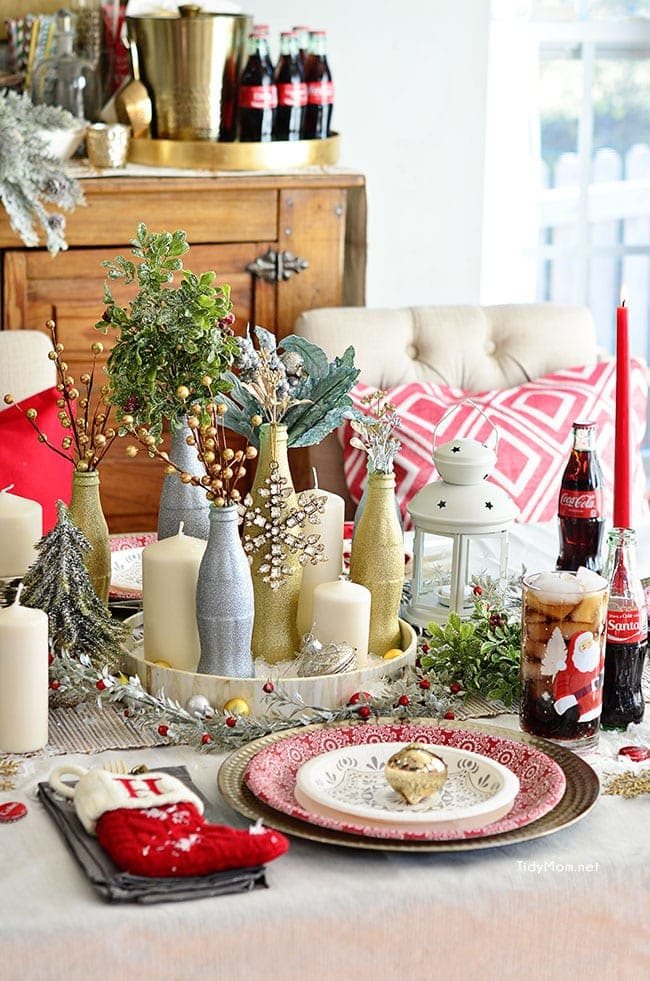 Use empty Cocoa Cola bottles as a pretty holiday table centerpiece. Just paint with glitter spray paint and add some holiday florals, and arrange on a tray. Easy and costs almost nothing! details at cetcu.com