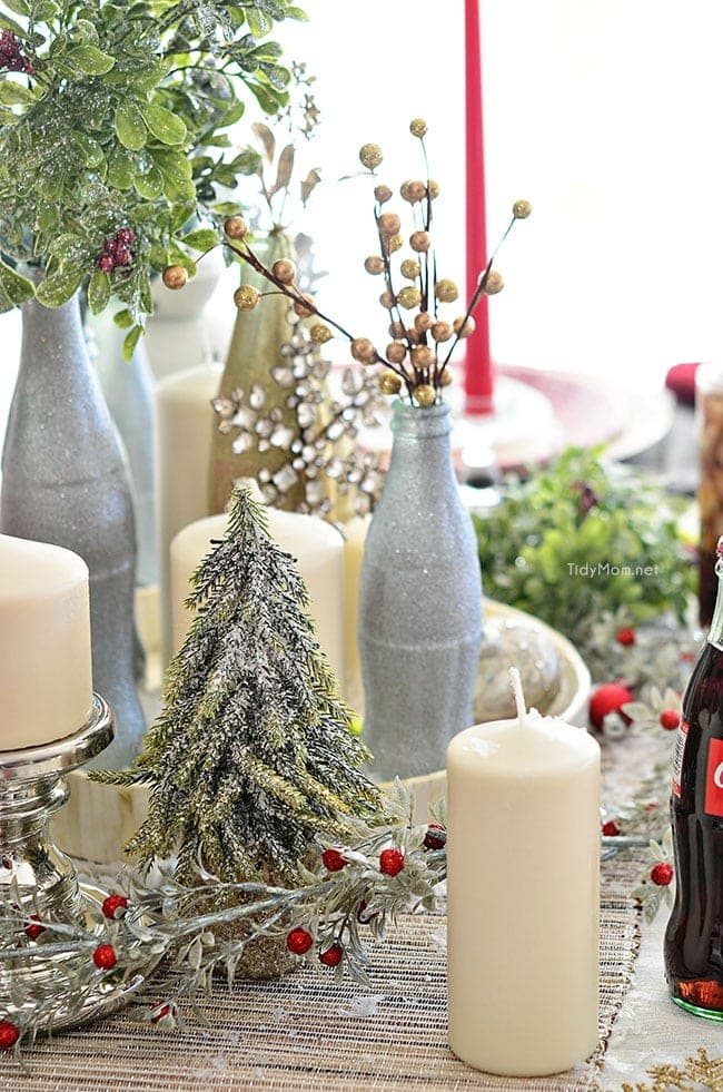 Use empty Cocoa Cola bottles as a pretty holiday table centerpiece. Just paint with glitter spray paint and add some holiday florals, and arrange on a tray. Easy and costs almost nothing! details at cetcu.com