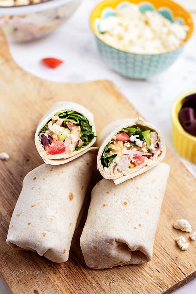 2 chicken wraps on a cutting board