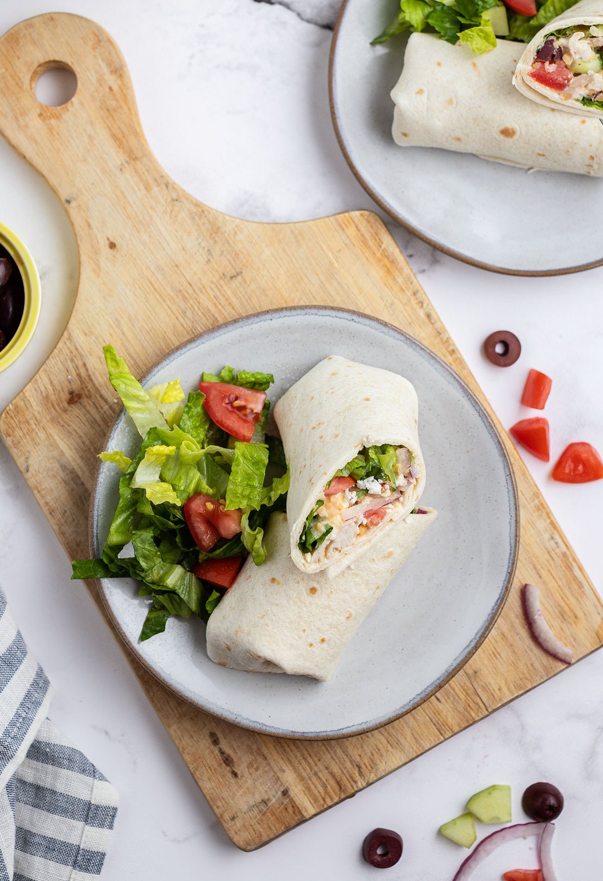 Greek tortilla wrap plated with a simple salad