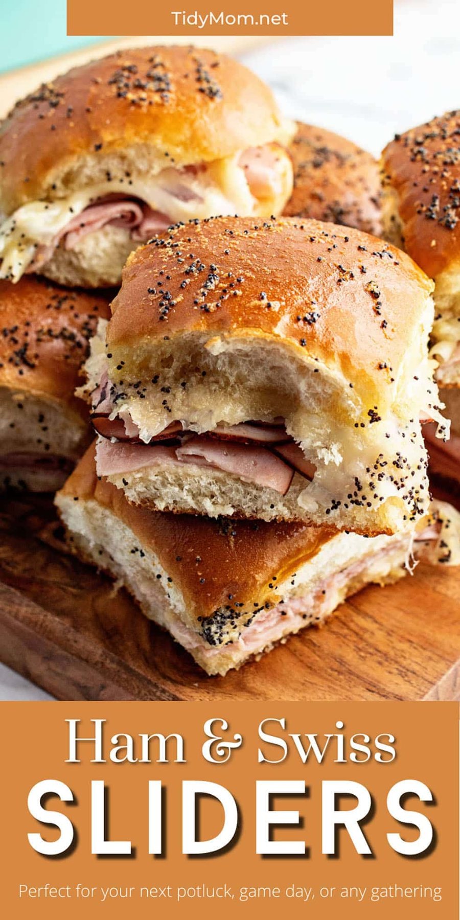 slider sandwiches stacked on wood tray