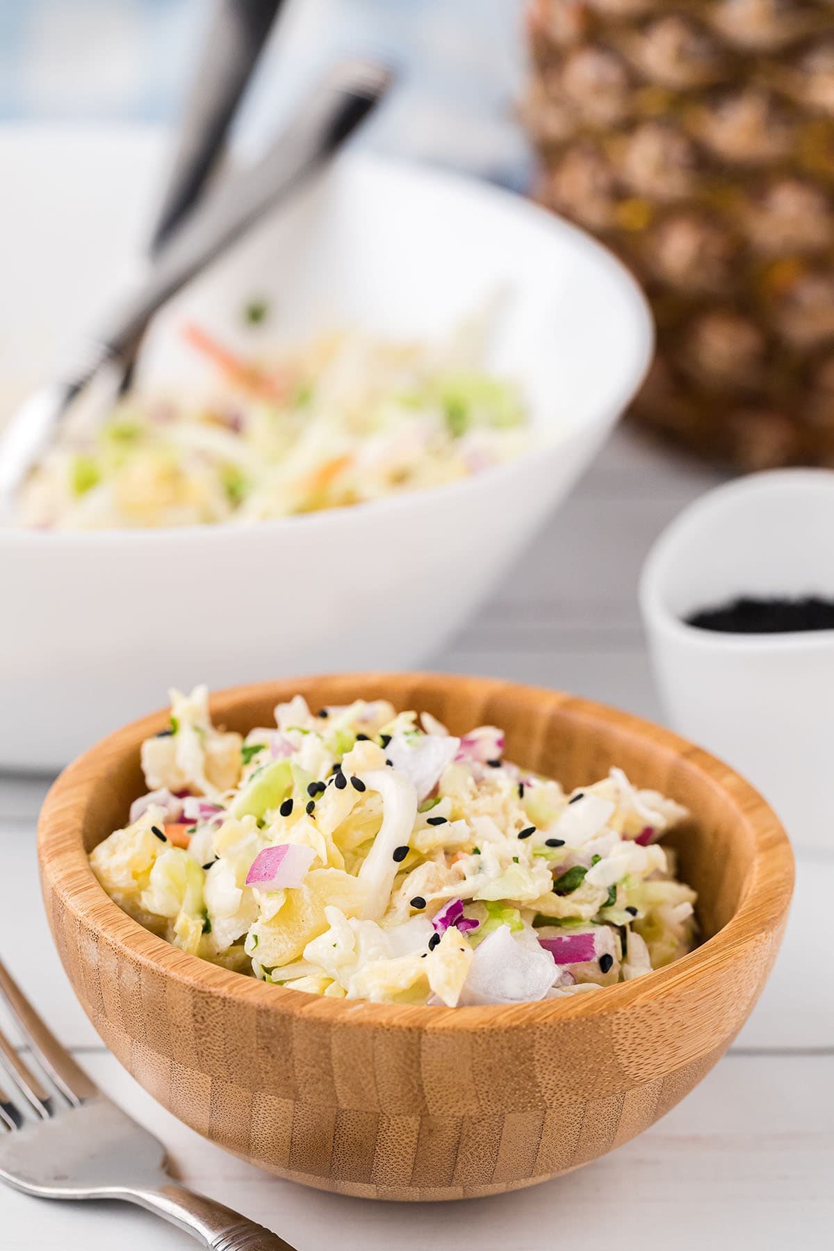 serving of coleslaw in wood bowl